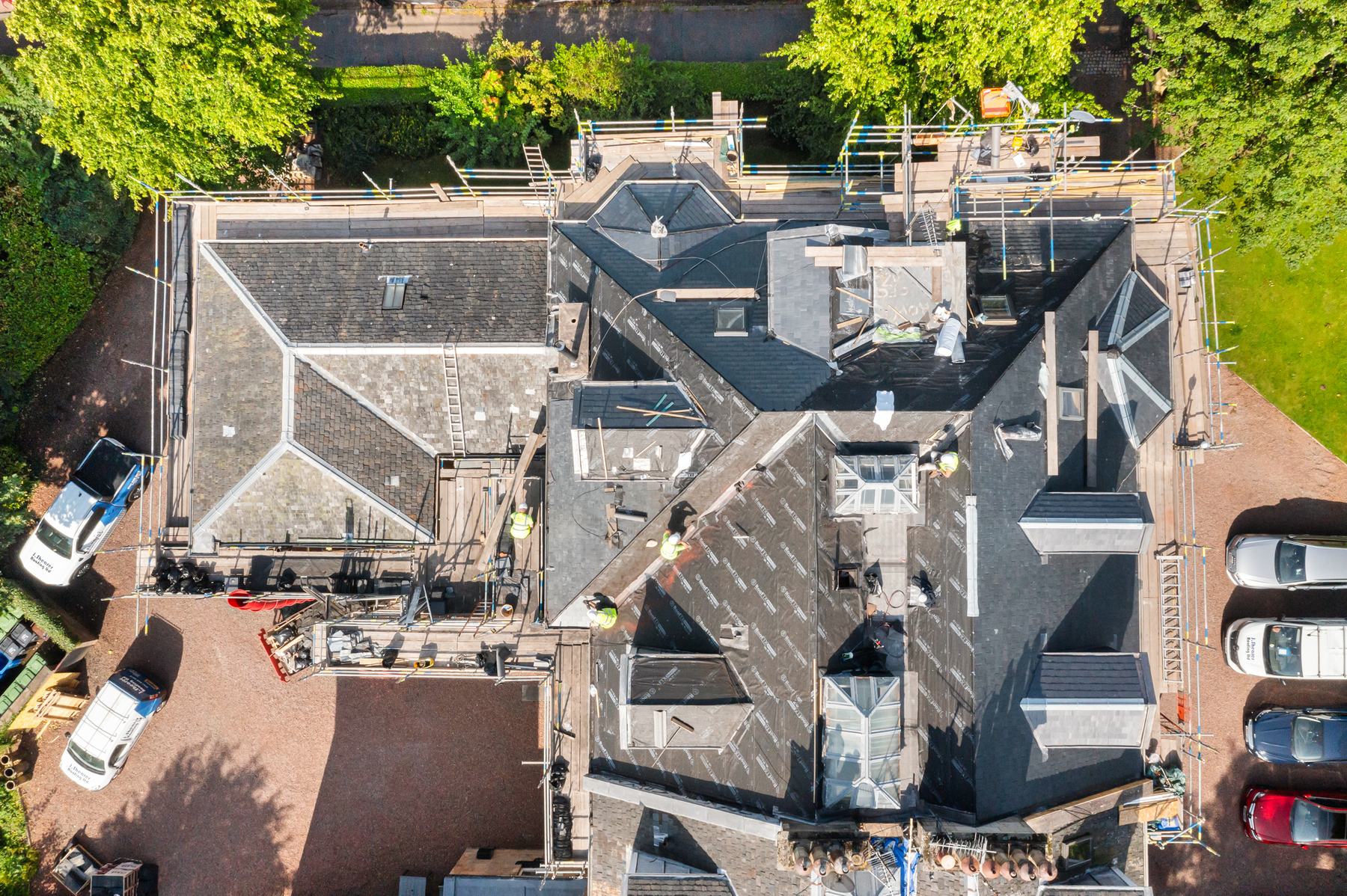 Aerial construction photography of roofers at work