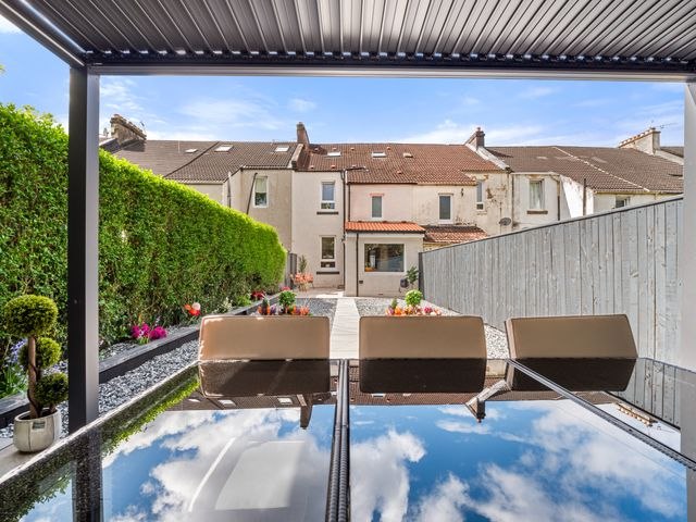 Garden patio with pergola and outdoor seating