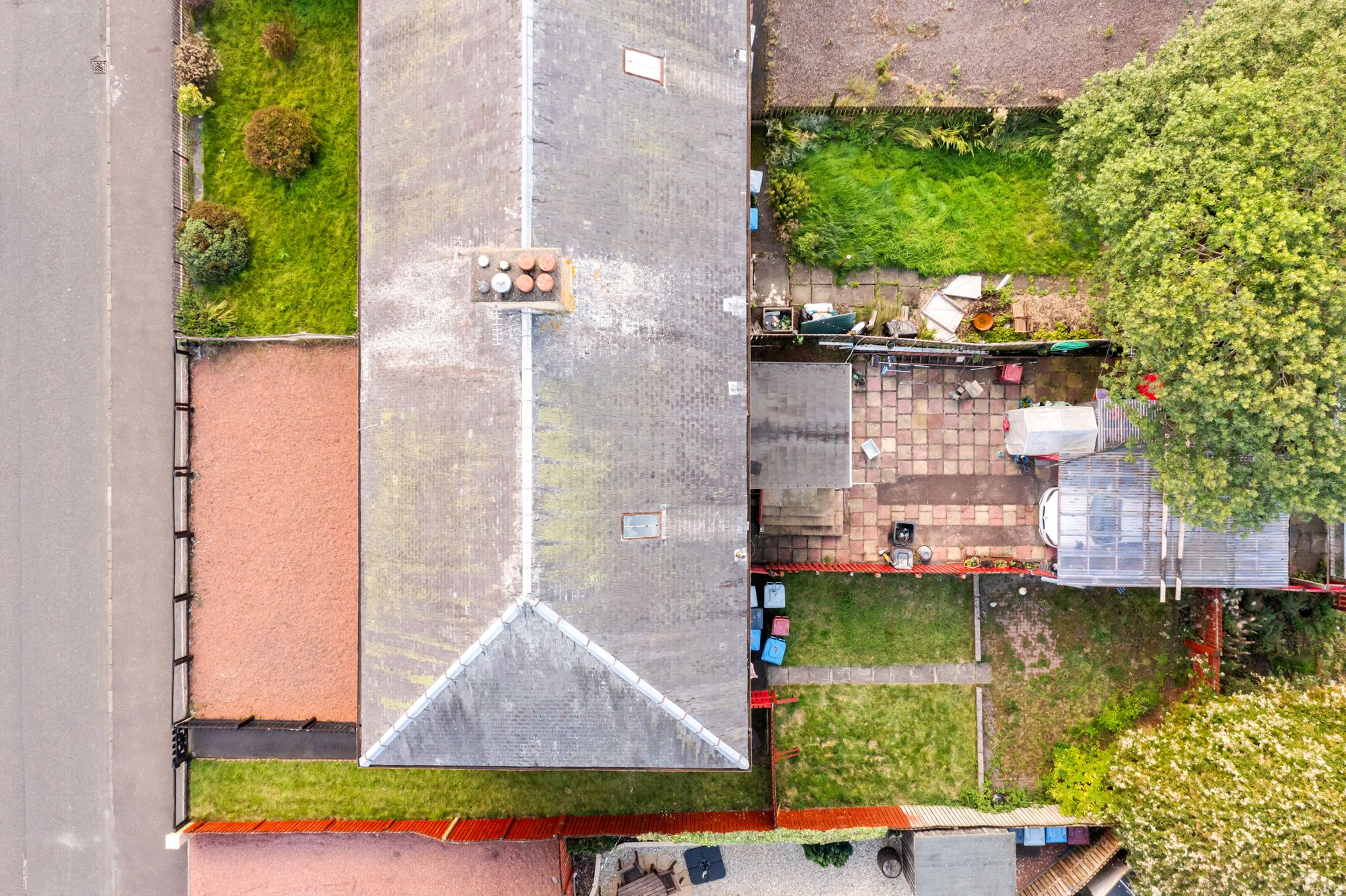 Aerial drone photograph over rooftops and rear gardens