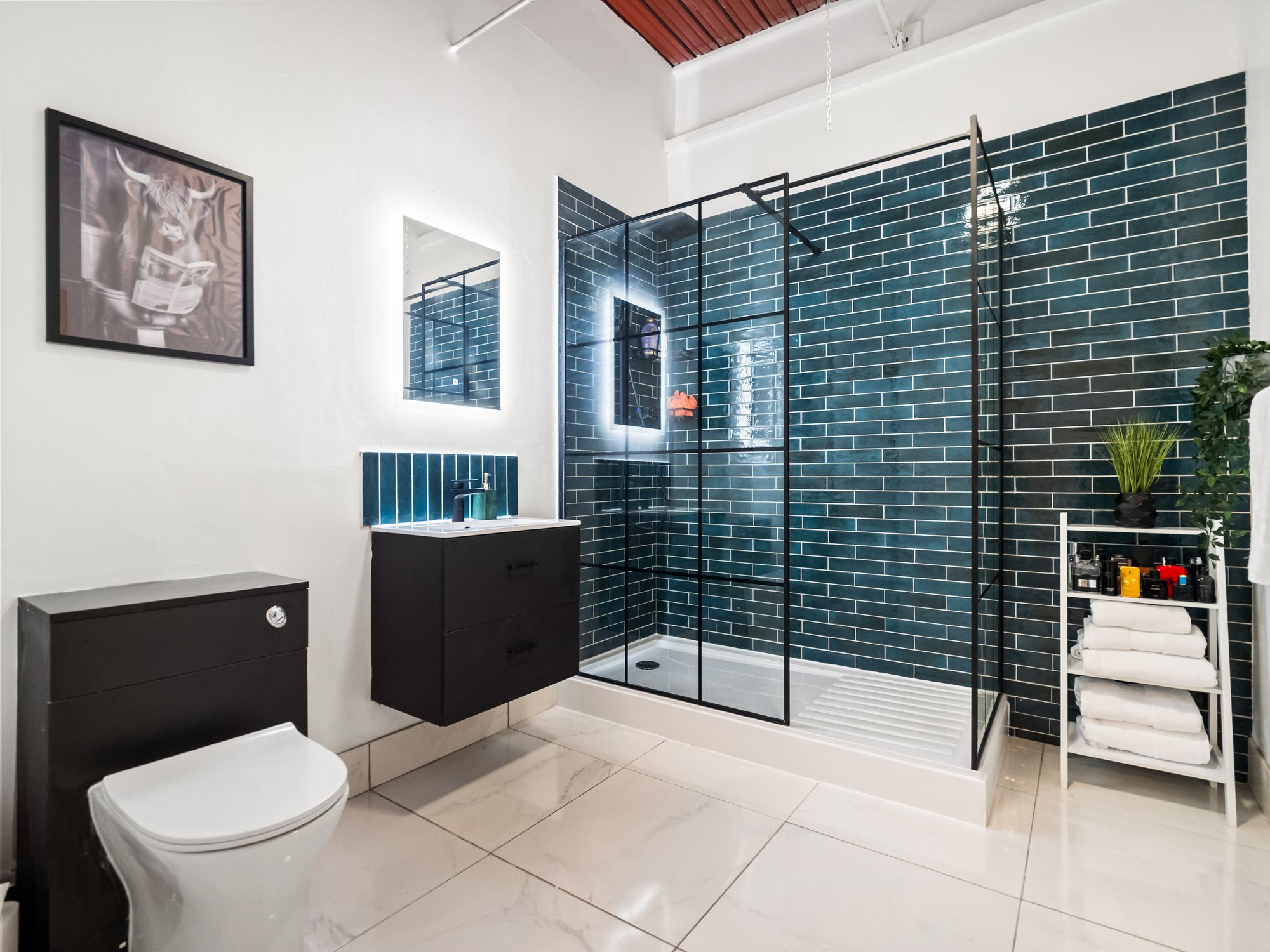 Bathroom with navy metro tile walk-in shower