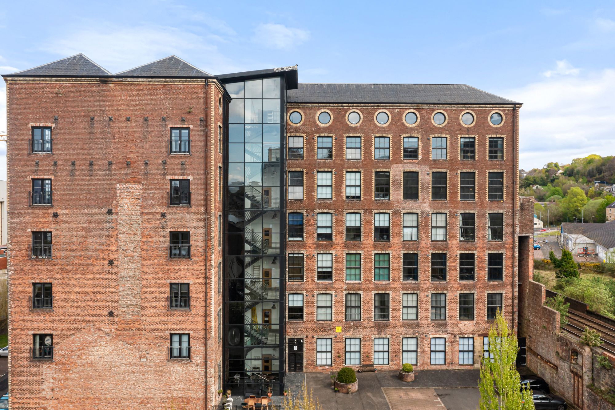 Converted red brick mill building exterior