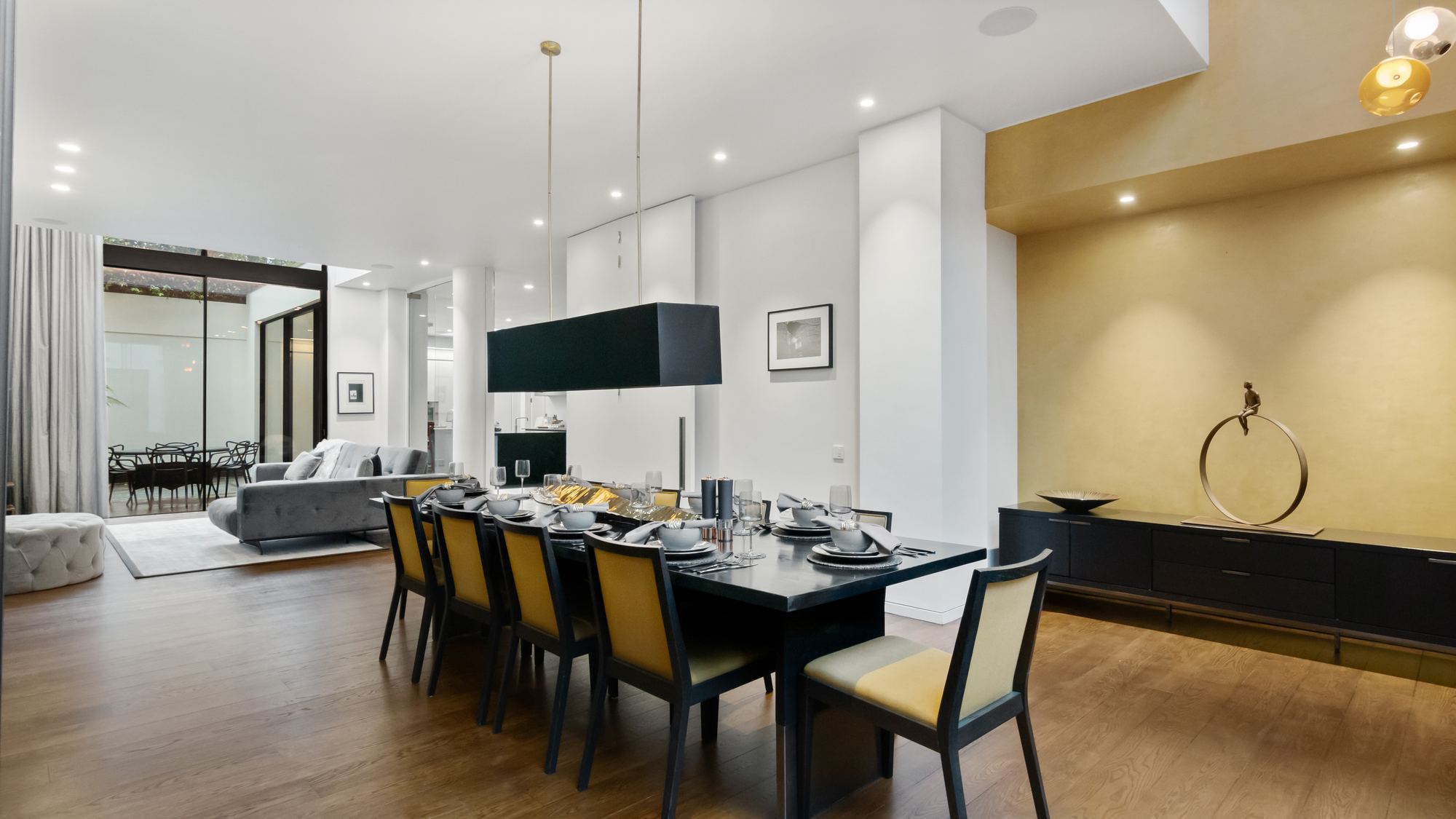 Formal dining room set for ten with sculpture display