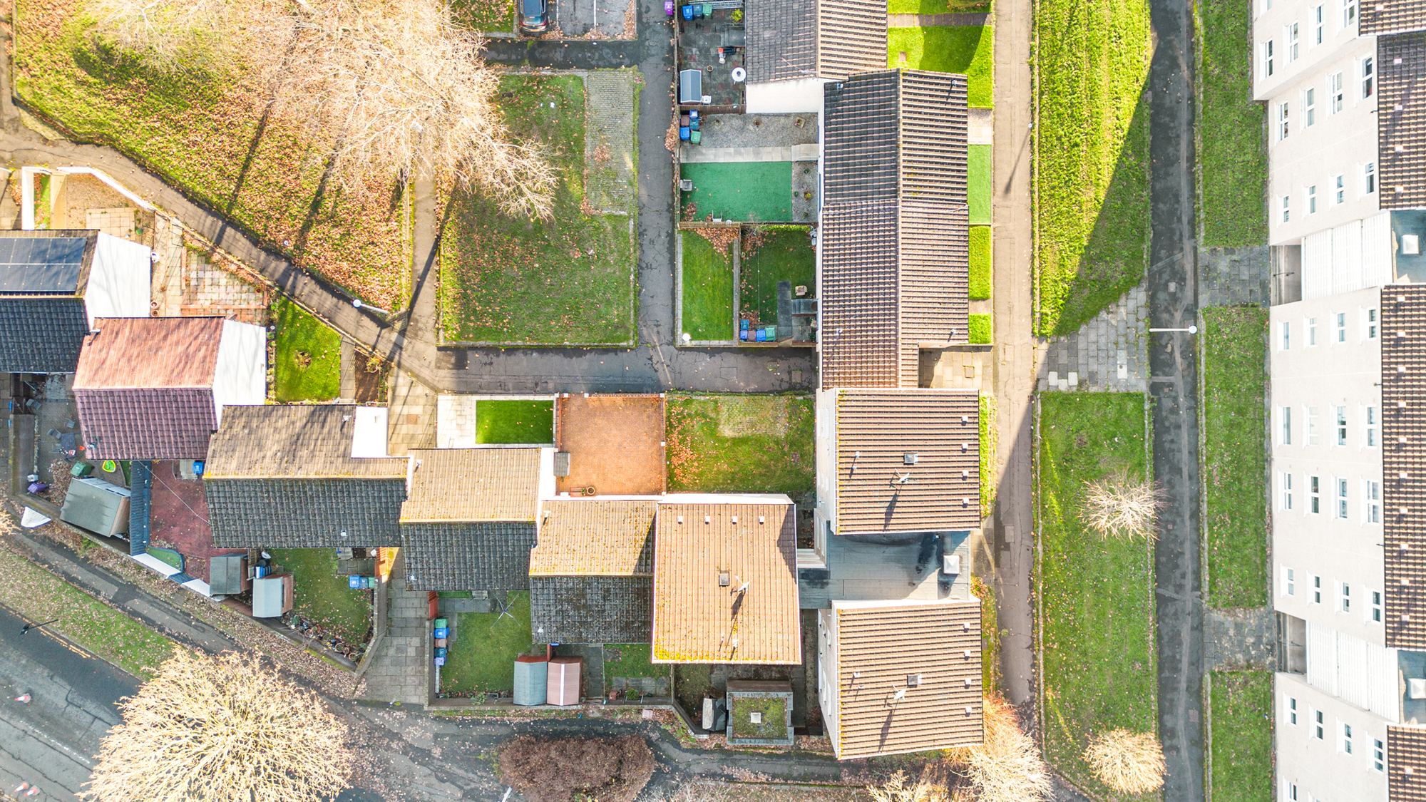 Aerial drone photograph of rear gardens and rooftops