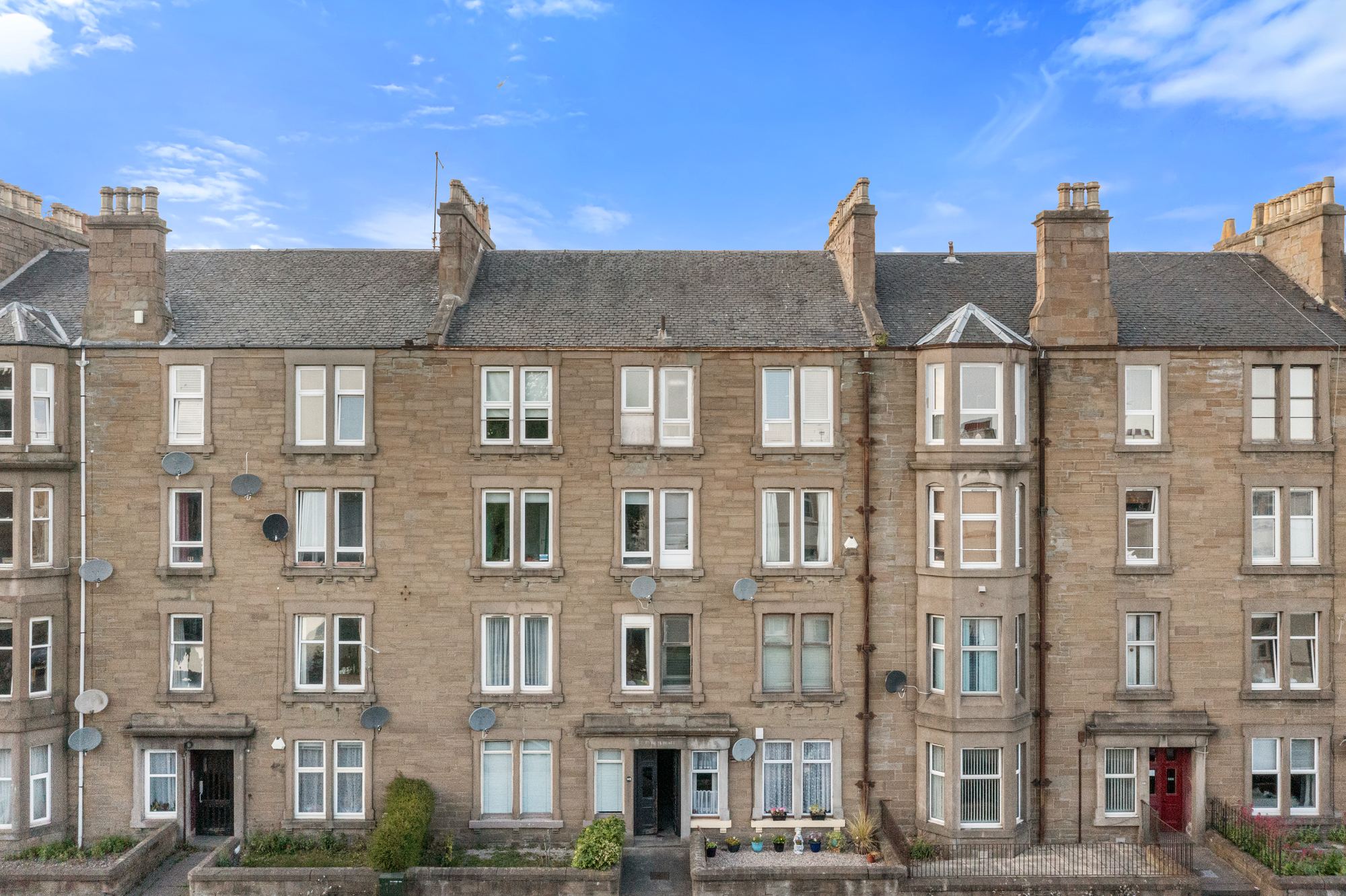 Sandstone tenement building with corner turret in Dundee