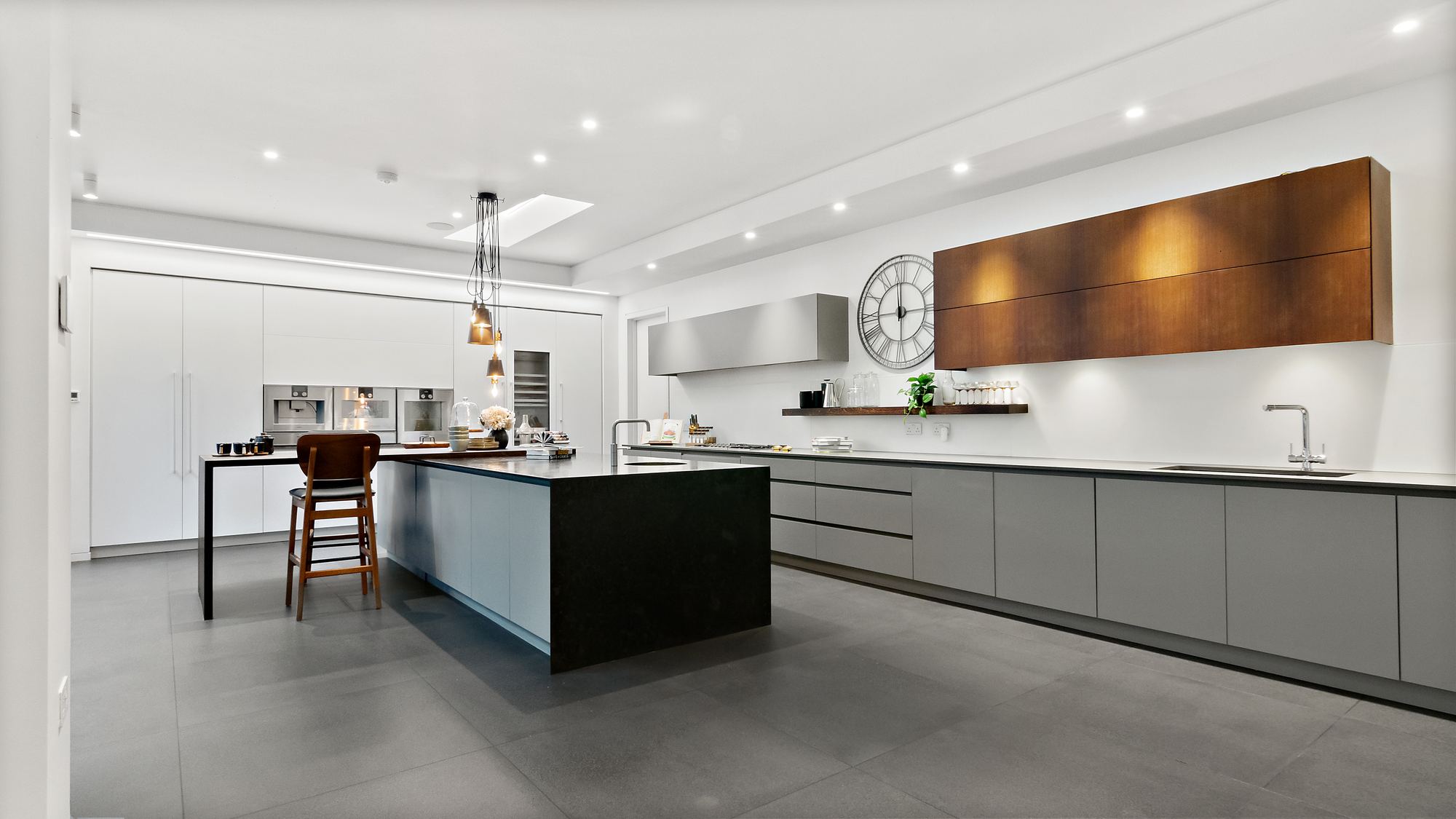 Modern kitchen with large island and copper cabinetry