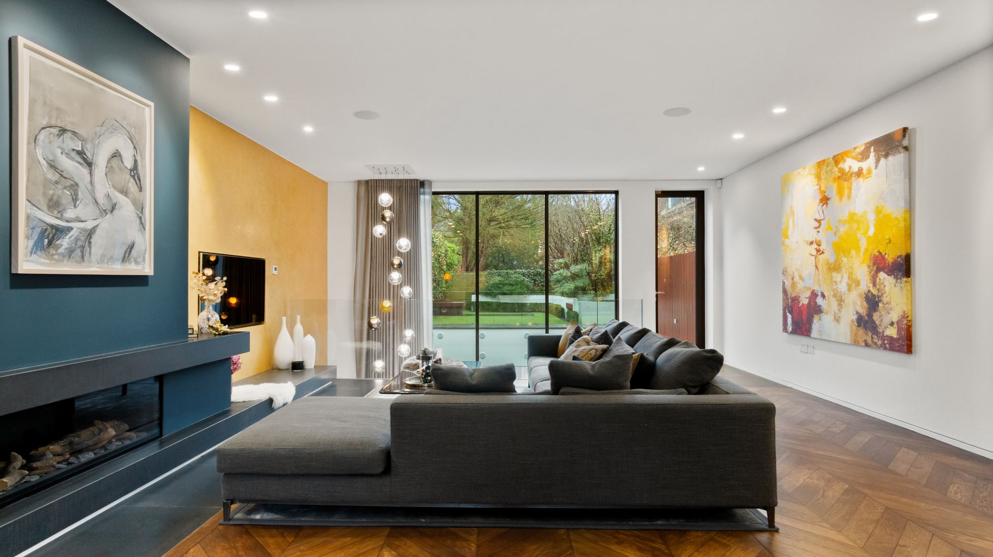 Living room with blue and mustard feature walls