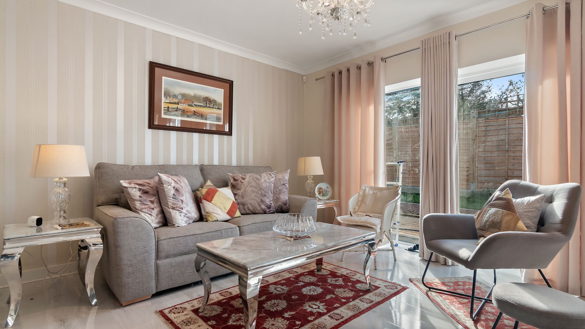 Living room with striped wallpaper and garden view