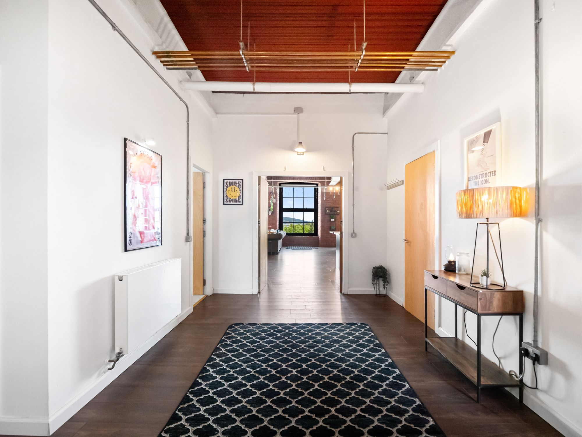 Loft apartment hallway with patterned rug