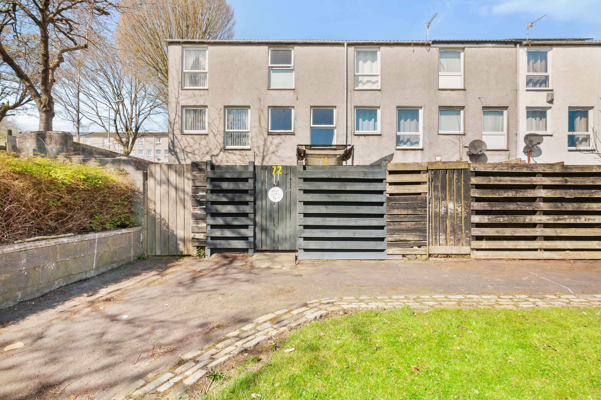 Rear garden with timber fencing and gated entrance