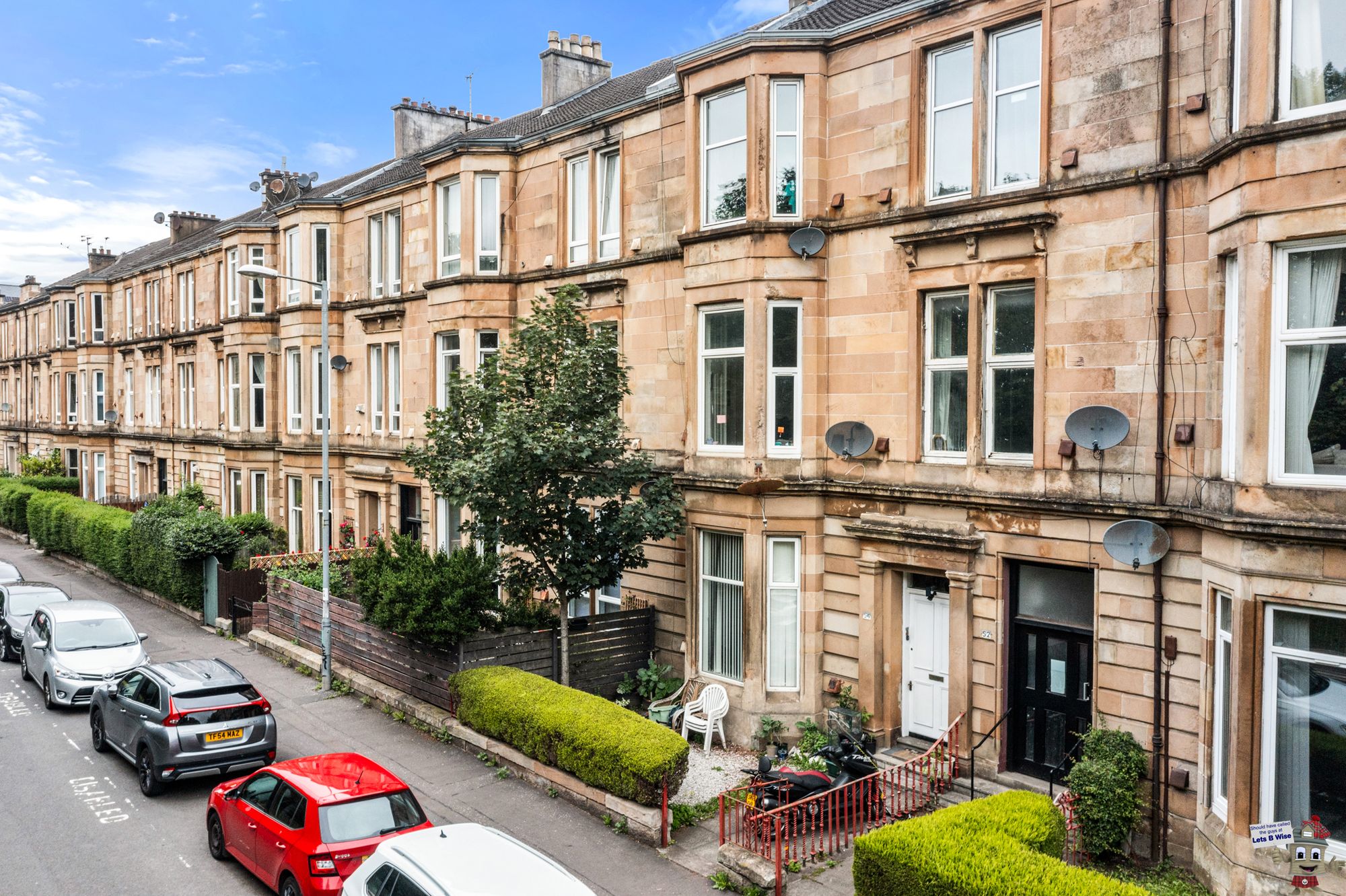Row of traditional tenement buildings on a city street