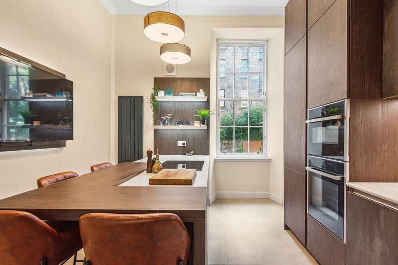 Modern kitchen with dark wood cabinetry